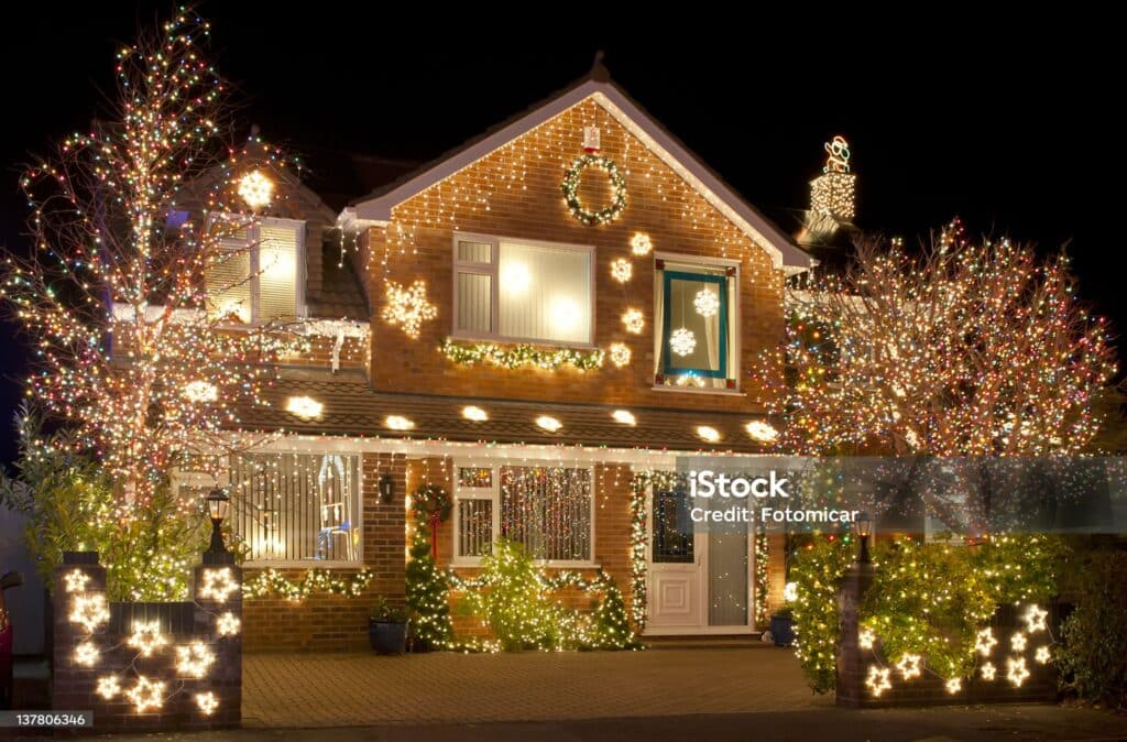 Christmas Lights outside on a house and in the garden